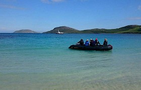 Guests coming ashore Vatersay beach