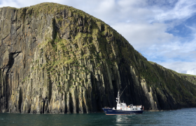 Elizabeth G anchored under the cliffs of the Shiant Isles