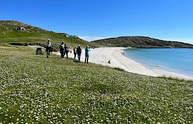 Guests ashore at Eriskay by Guide Lynsey Bland