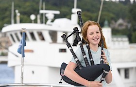 Evie playing the bagpipes (Photo Rosie Barrett)